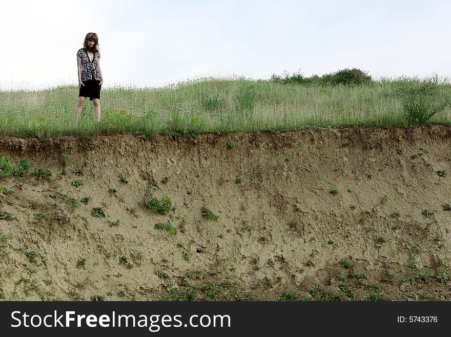 A beautiful girl walking on the field