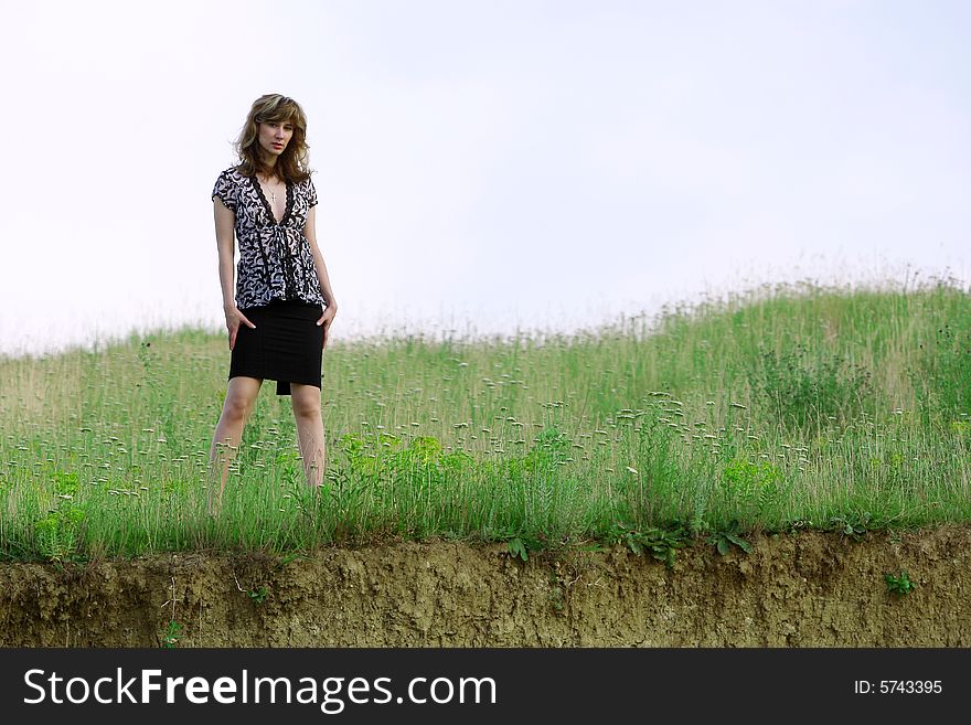 A beautiful girl walking on the field