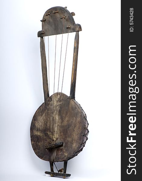 A banjo hand crafted from raw materials, typically found in countries of central and southern africa, usually hand made by shepherds, and used by them to to create a familiar tune for the animals to follow. A banjo hand crafted from raw materials, typically found in countries of central and southern africa, usually hand made by shepherds, and used by them to to create a familiar tune for the animals to follow.