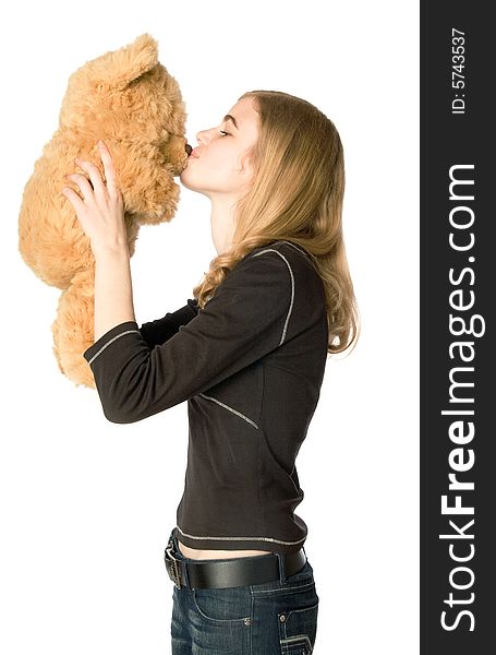 Young girl hugging a Teddy bear, isolated. Young girl hugging a Teddy bear, isolated