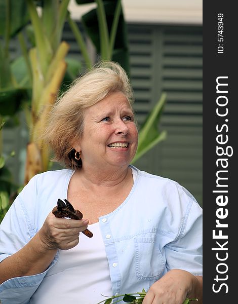 Photo of a senior doing some yard work. Photo of a senior doing some yard work