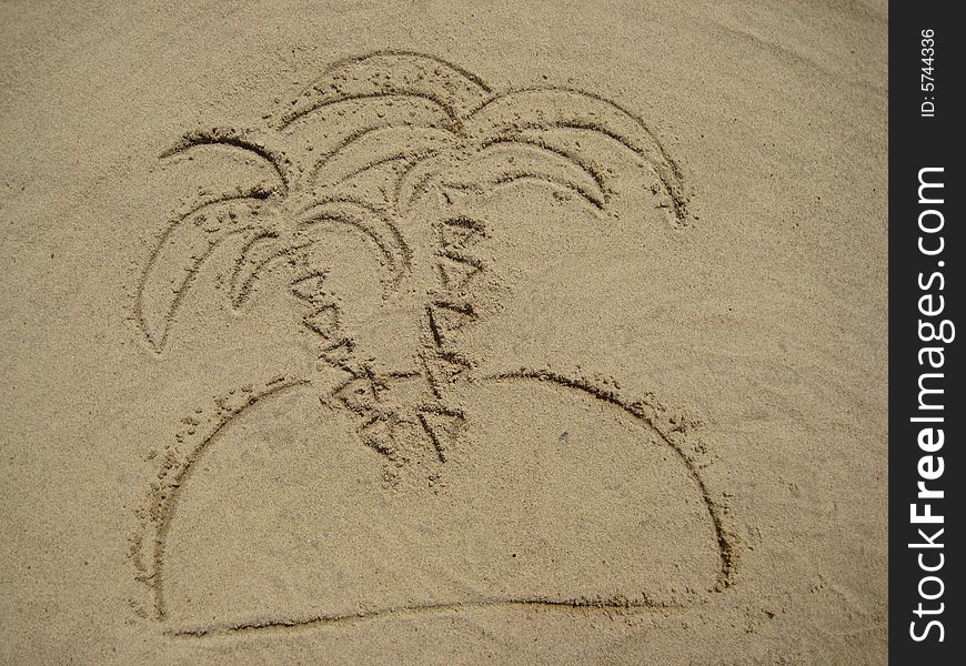 View of figures palm tree on sand