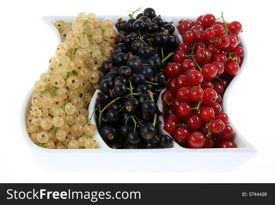 Bowl of currants isolated on a white background. Bowl of currants isolated on a white background.