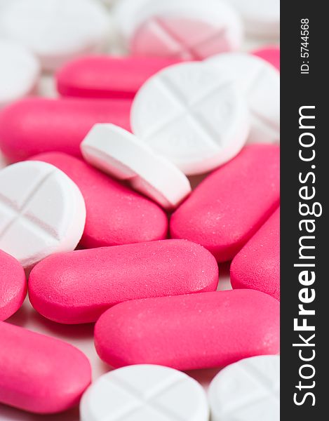 Close up of pink and white pills. Close up of pink and white pills