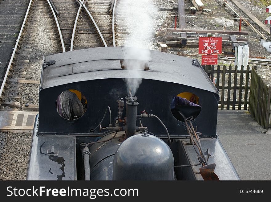 Steam train in shunting yard.
