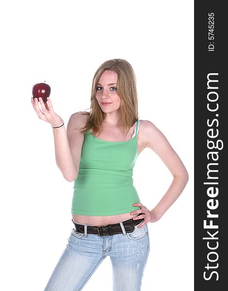 Pretty woman in green holding a red apple. Pretty woman in green holding a red apple