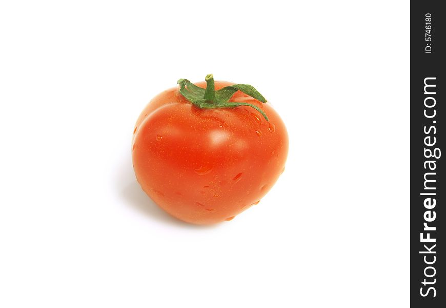 Fresh red tomato with water drops and isolated on white background. Fresh red tomato with water drops and isolated on white background