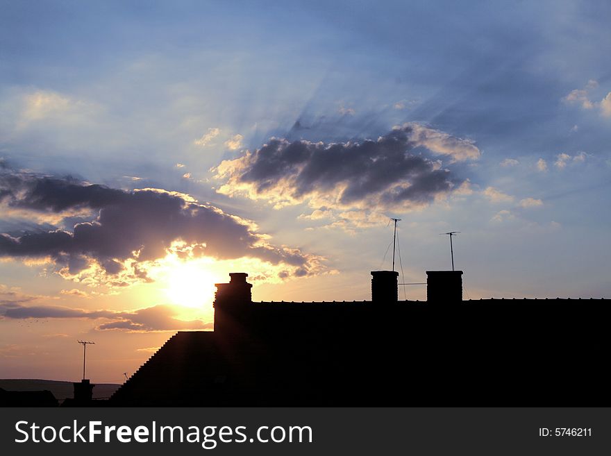 Urban sunrise with clouds and building