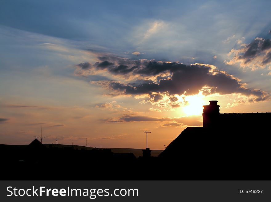 Urban sunrise with clouds and funnel. Urban sunrise with clouds and funnel