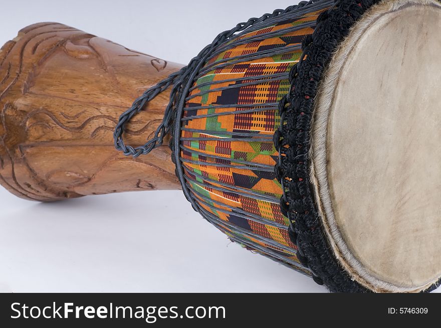 Close up of a Jemba drum with the typical bright colors of African tradition. Close up of a Jemba drum with the typical bright colors of African tradition.