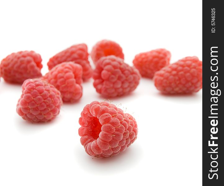 Raspberries very close, isolated on white background