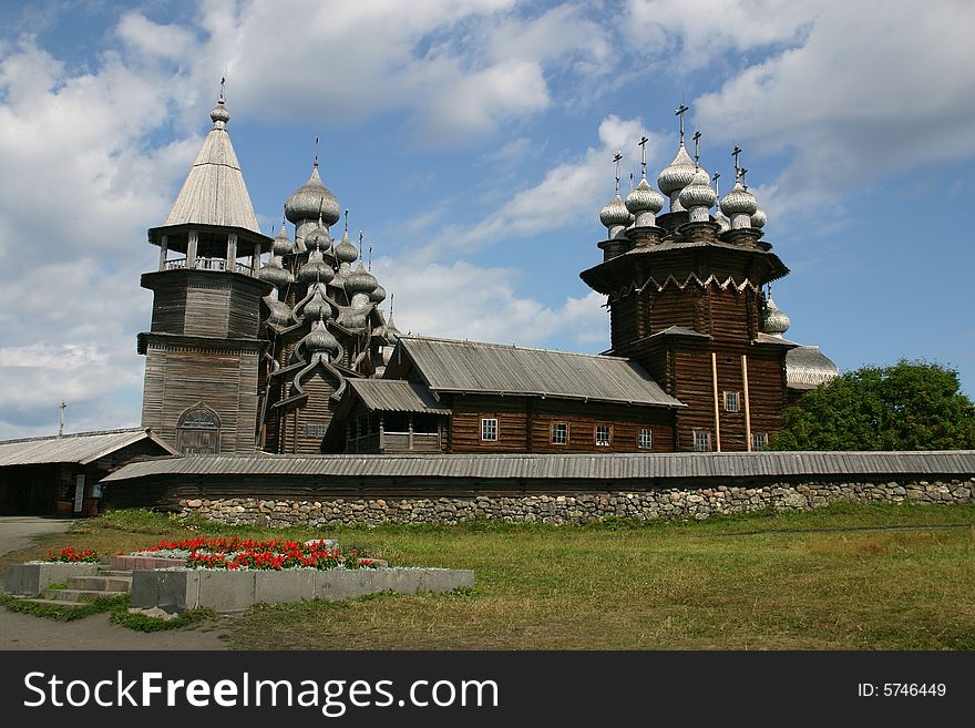 The museum of wooden architecture is located on the Kizhi island on Lake Onega in the Republic of Karelia, Russia. The Kizhi Pogost is the area inside the perimeter wall or fence and includes 2 large churches and a bell-tower.