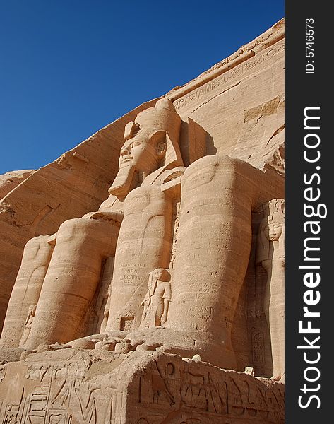 Two of the colossal statues of Rameses II seen from beneath, emphasizing the huge size, Abu Simbel, Egypt. Two of the colossal statues of Rameses II seen from beneath, emphasizing the huge size, Abu Simbel, Egypt