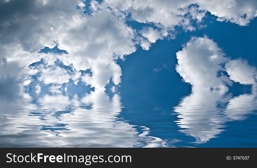 White clouds reflected in water. White clouds reflected in water