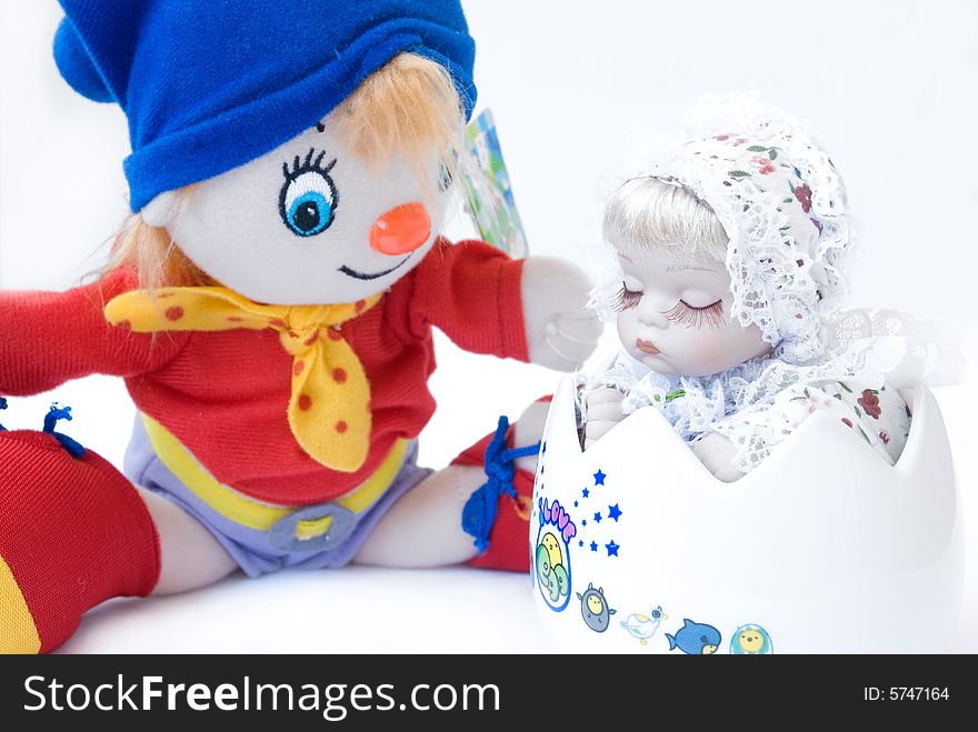 Smiling baby doll on white background