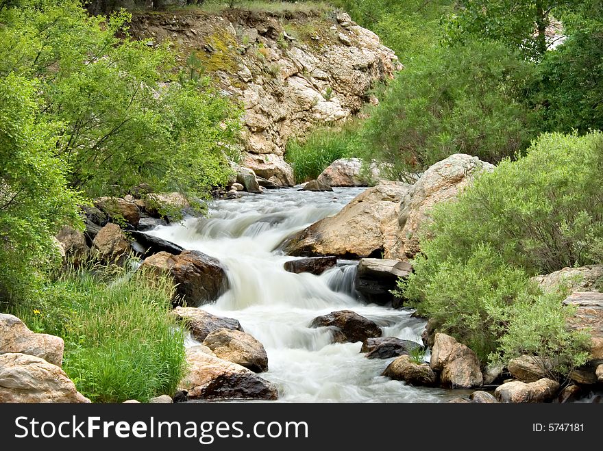 A swift moving stream in Colorado. A swift moving stream in Colorado.