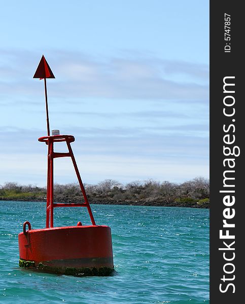 A buoy marker in a channel aids navigation of boats