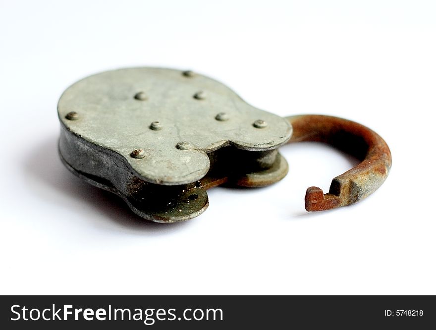 An old, sturdy, rusted padlock, laying open on a white background. An old, sturdy, rusted padlock, laying open on a white background.