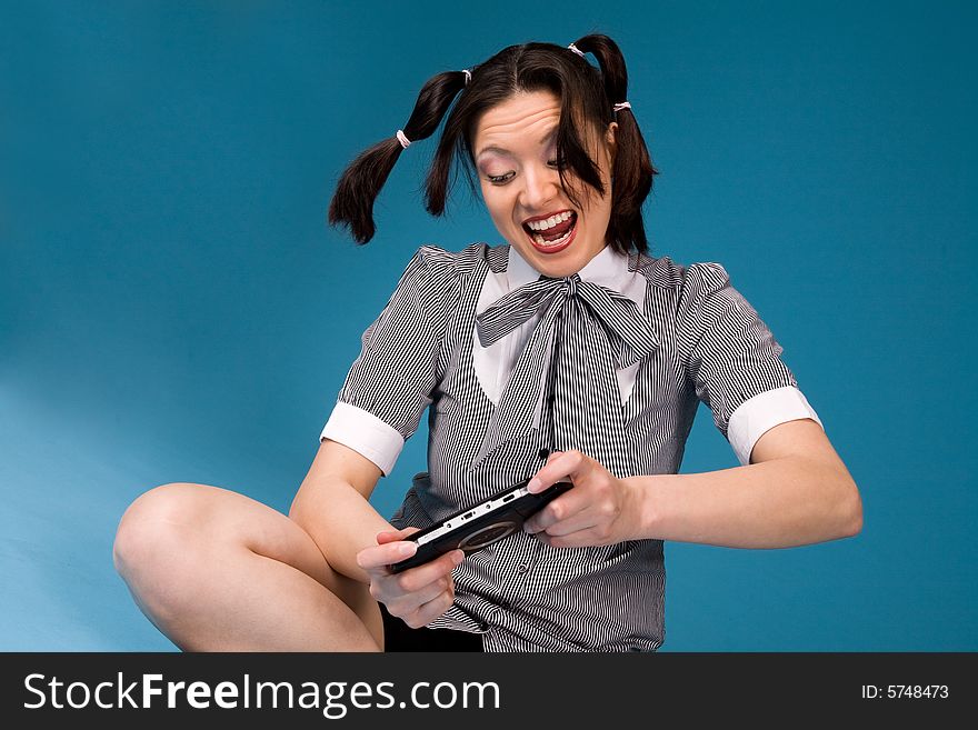 Young concentrated girl playing a game. Young concentrated girl playing a game.