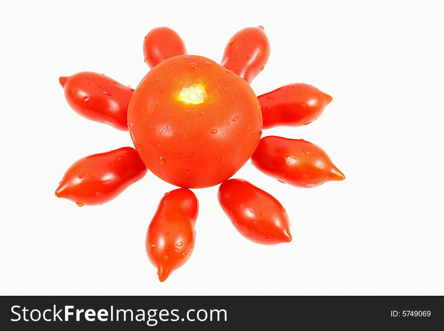 One big and some little tomatoes on white