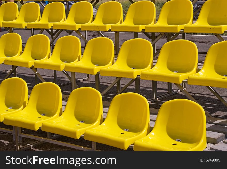 Lines of yellow seats. Yellow seats.