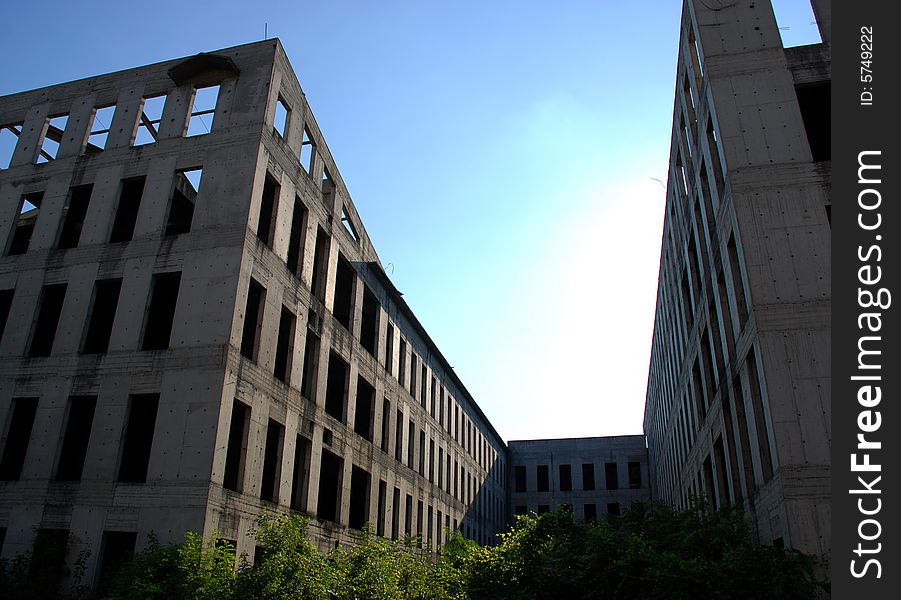 Two unfinished buildings in the aftrnoon