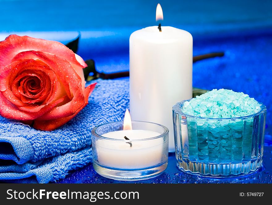 Spa essentials (candles, towel, salt and flower)