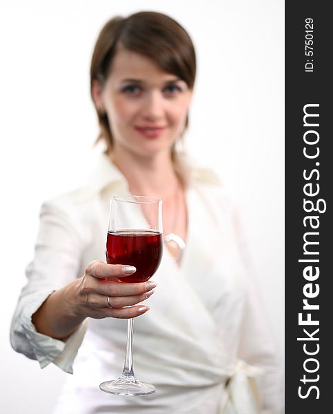 Beautiful girl with glass of red wine on white background.