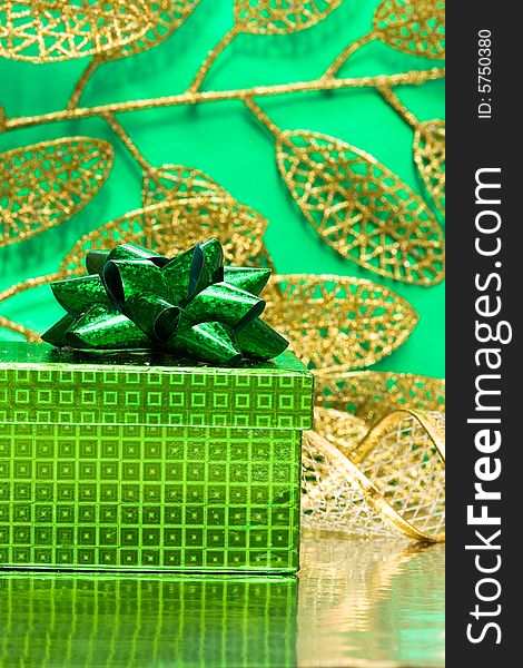 Gift box on green background with leaf