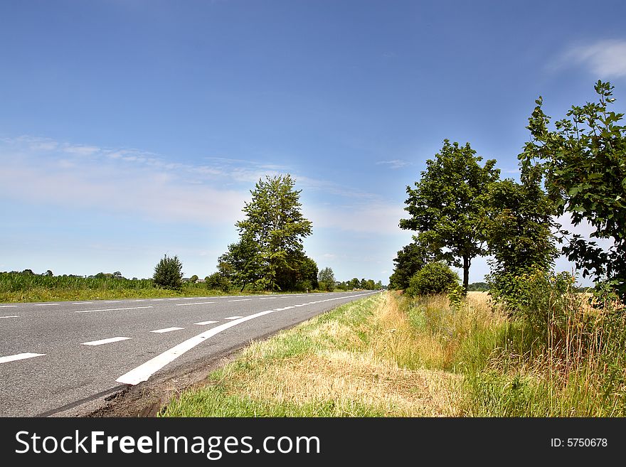 Countryside road with blue sky in backround