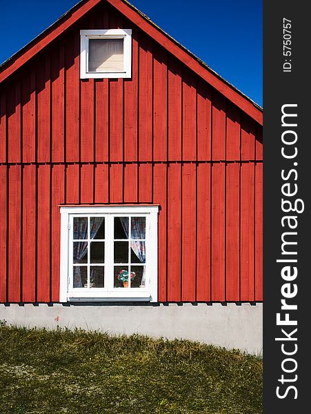 Facade of a vivid red cottage (Sweden)