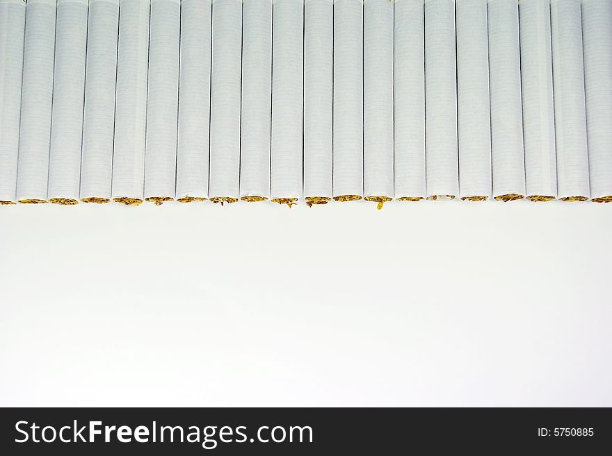 Cigarettes arranged in line close up shot. Cigarettes arranged in line close up shot