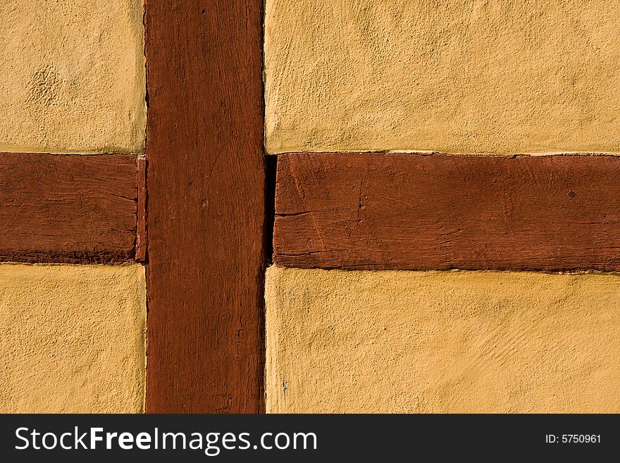 Wooden cross in a yellow wall (Sweden). Wooden cross in a yellow wall (Sweden)