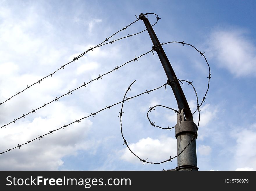 Three lines of barbed wire. Three lines of barbed wire