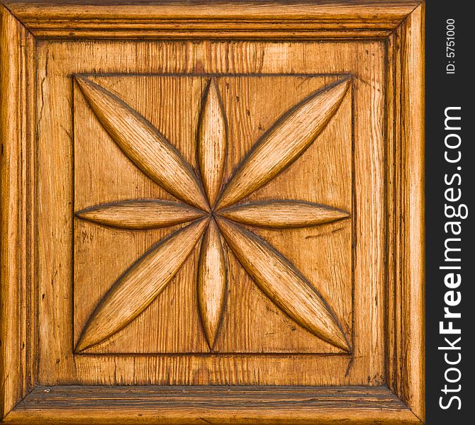 Carved wooden floral detail with a frame. Carved wooden floral detail with a frame