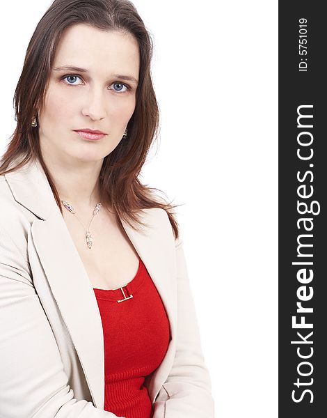 Beautiful brunette businesswoman wearing a beige jacket and a red top. Isolated on white background with copy space