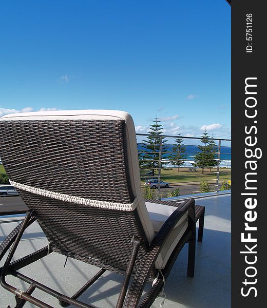 Chair on balcony with ocean view