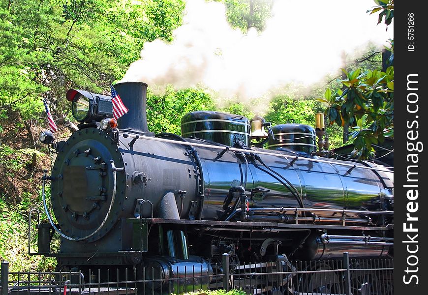 A vintage steam engine used in WWII taking off from the station. A vintage steam engine used in WWII taking off from the station.