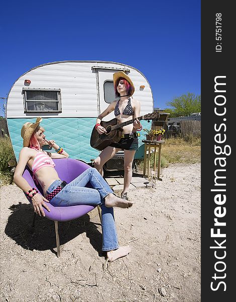 Two Young Punk Women in Front of a Trailer. Two Young Punk Women in Front of a Trailer