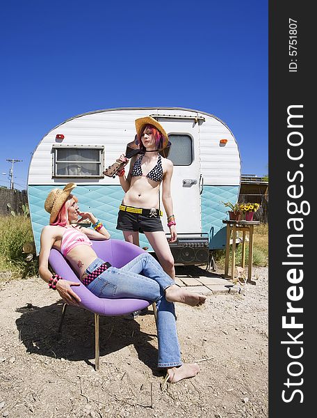 Young Women in Front of a Trailer