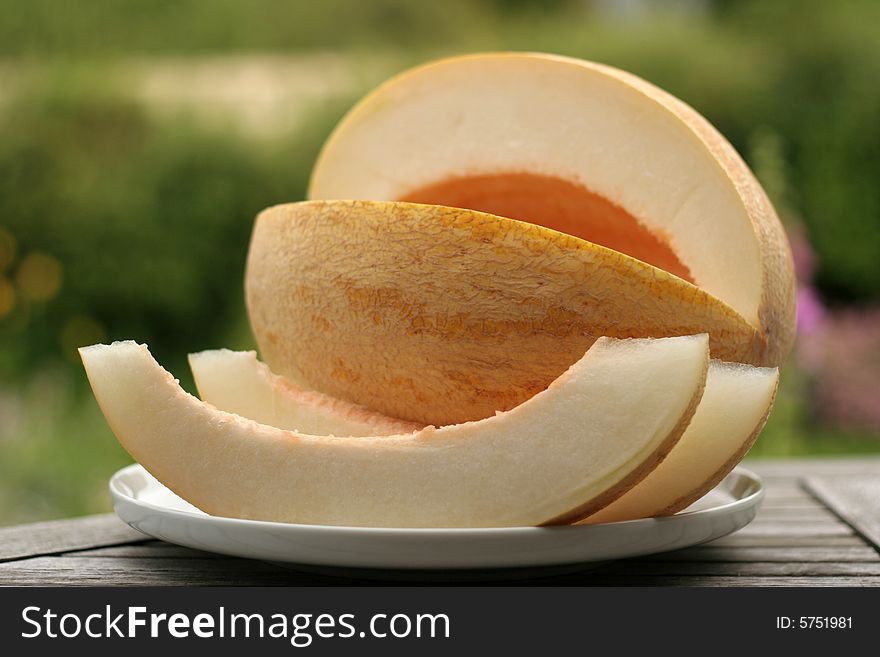 The ripe cut melon on a table