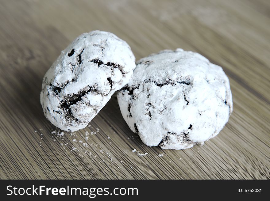 Bottoni biscuits isolated against a wooden bench