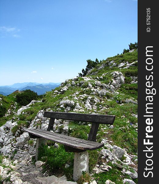 A wooden bench on Utenberg in the Alps by Salzburg, Austria. A wooden bench on Utenberg in the Alps by Salzburg, Austria