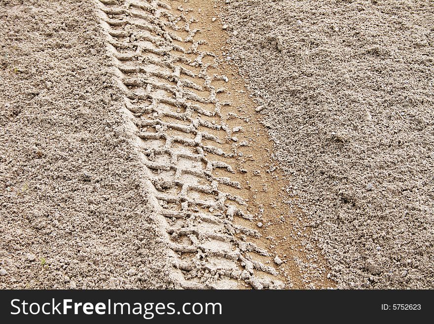 Picture of a tire track left on the sand. Picture of a tire track left on the sand