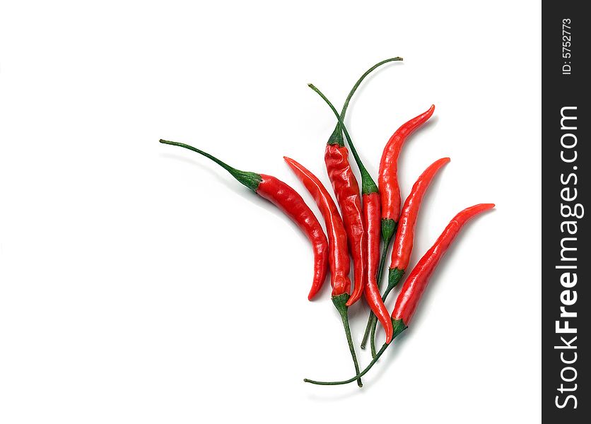 Red Hot Chili Cayenne Peppers Arranged On White