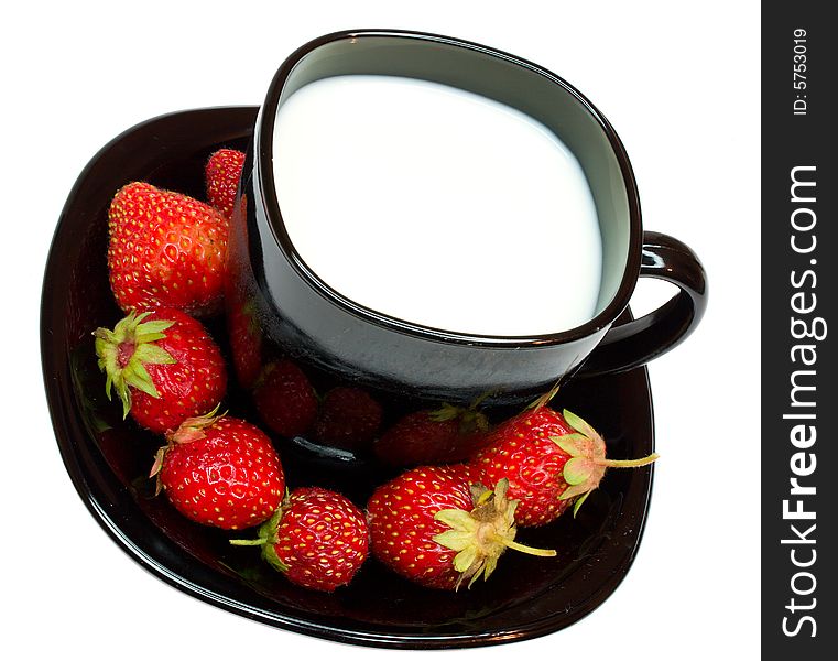 Close-up cup of milk and strawberries, isolated on white