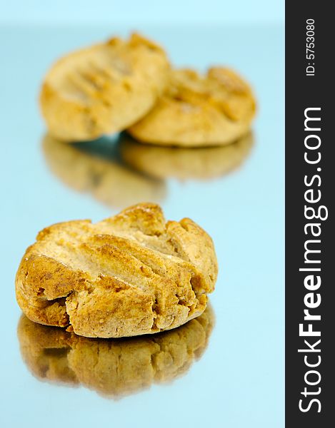 Ginger biscuits isolated against a blue background