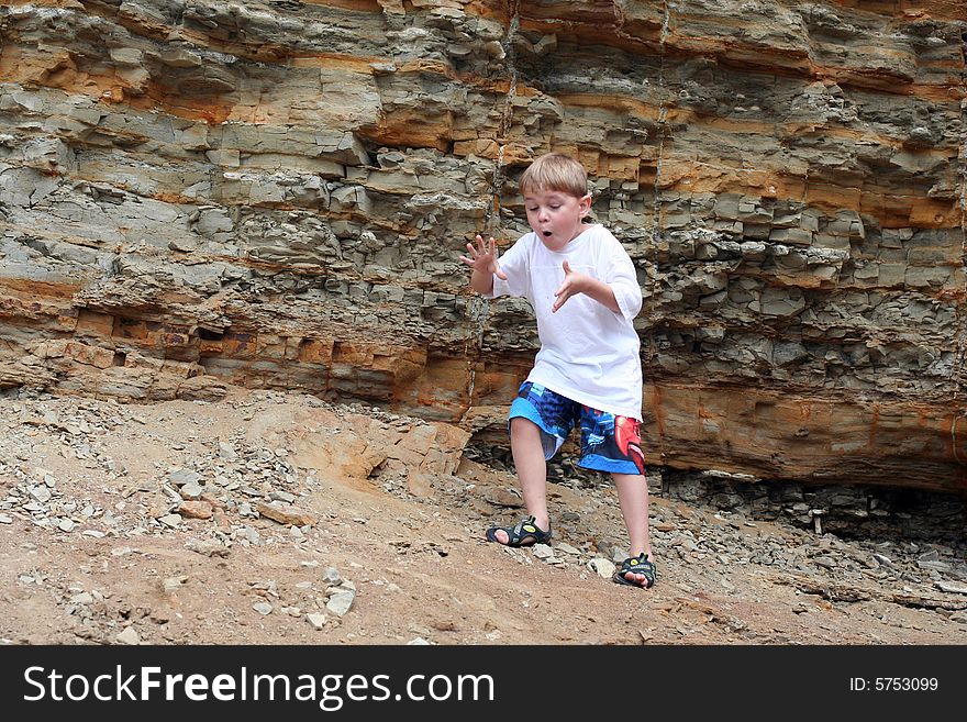 Excited boy at ocean tidepools