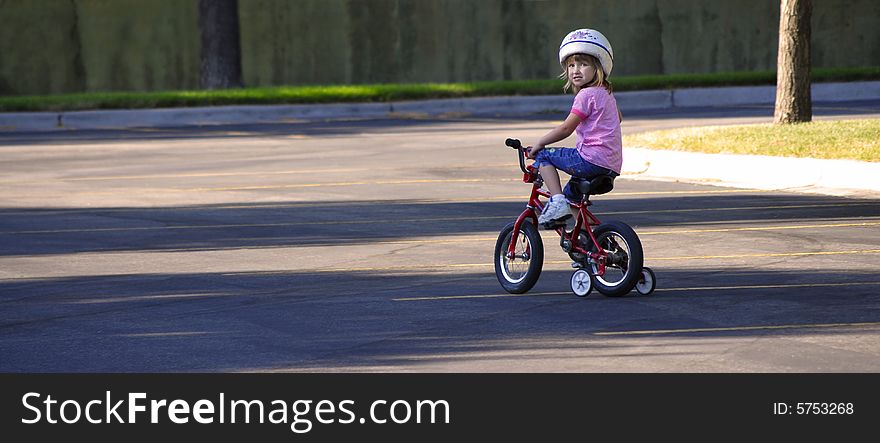 Little Girl Riding a Bike