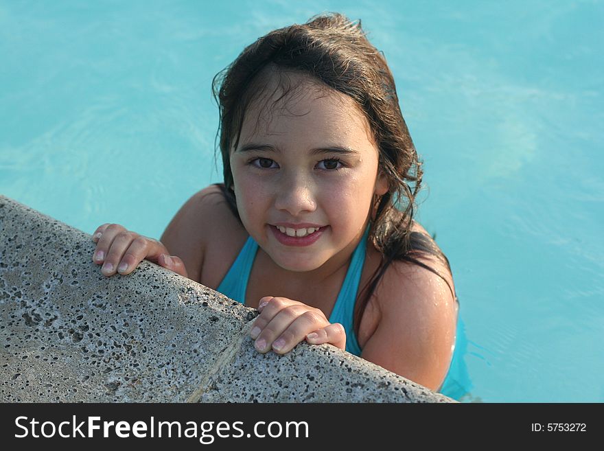 Smiling girl in swimming pool